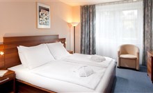 FRYMBURK - Frymburk - Pohled na postel ve standard pokoji hotelu Frymburk.
